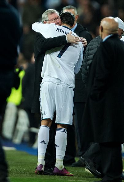 Cristiano Ronaldo (R) of Real Madrid embraces Sir Alex Ferguson, manager of Manchester United, at the end of the UEFA Champions League Round of 16 first leg match between Real Madrid and Manchester United at Estadio Santiago Bernabeu on February 13, 2013 in Madrid, Spain. (Photo by Jasper Juinen/Getty Images)
